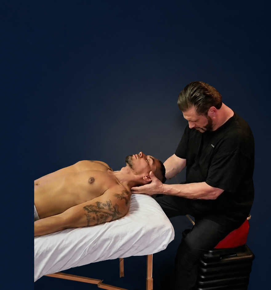 Anthony Bolognini providing hands-on massage therapy